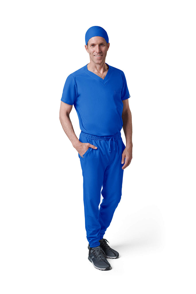 Man wearing MedTailor men's scrub cap in Royal Blue color fabric