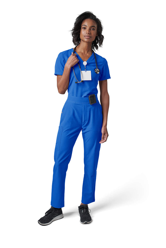 Woman wearing MedTailor women's scrub pants in Royal Blue color fabric