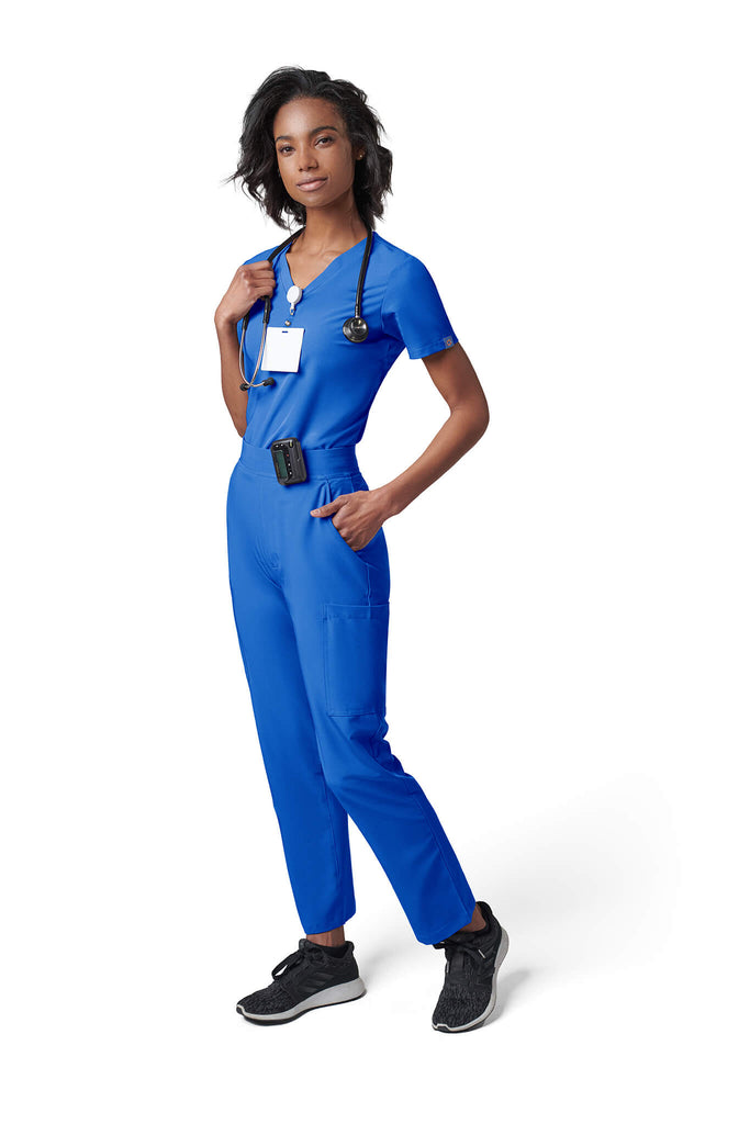 Woman wearing MedTailor women's scrub pants in Royal Blue color fabric