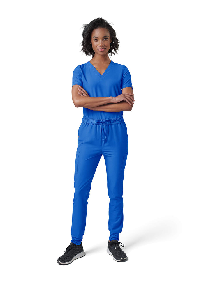 Woman wearing MedTailor women's scrub pants in Royal Blue color fabric