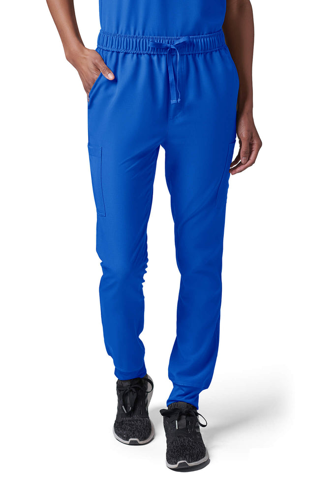 Woman wearing MedTailor women's scrub pants in Royal Blue color fabric
