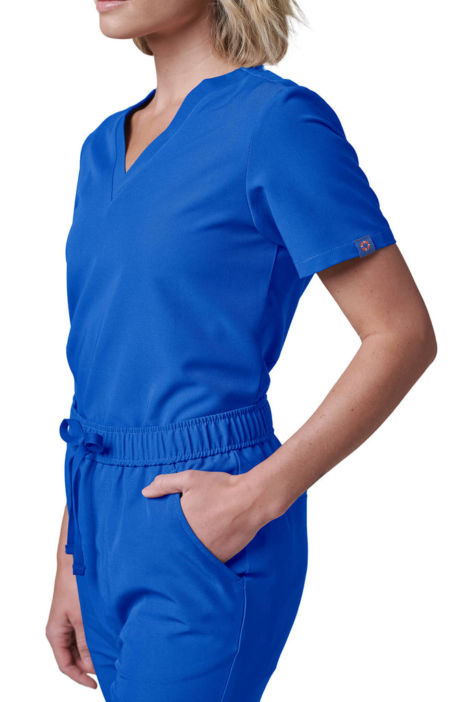 Woman wearing MedTailor women's scrub top in Royal Blue color fabric