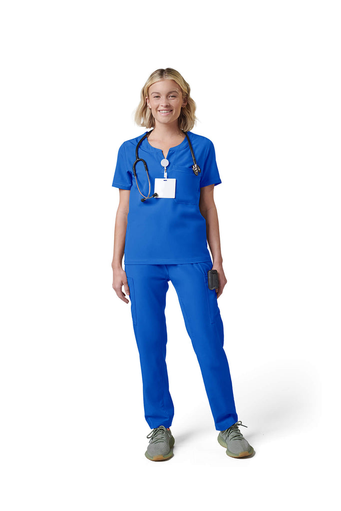 Woman wearing MedTailor women's scrub top in Royal Blue color fabric