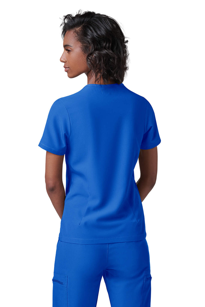 Woman wearing MedTailor women's scrub top in Royal Blue color fabric