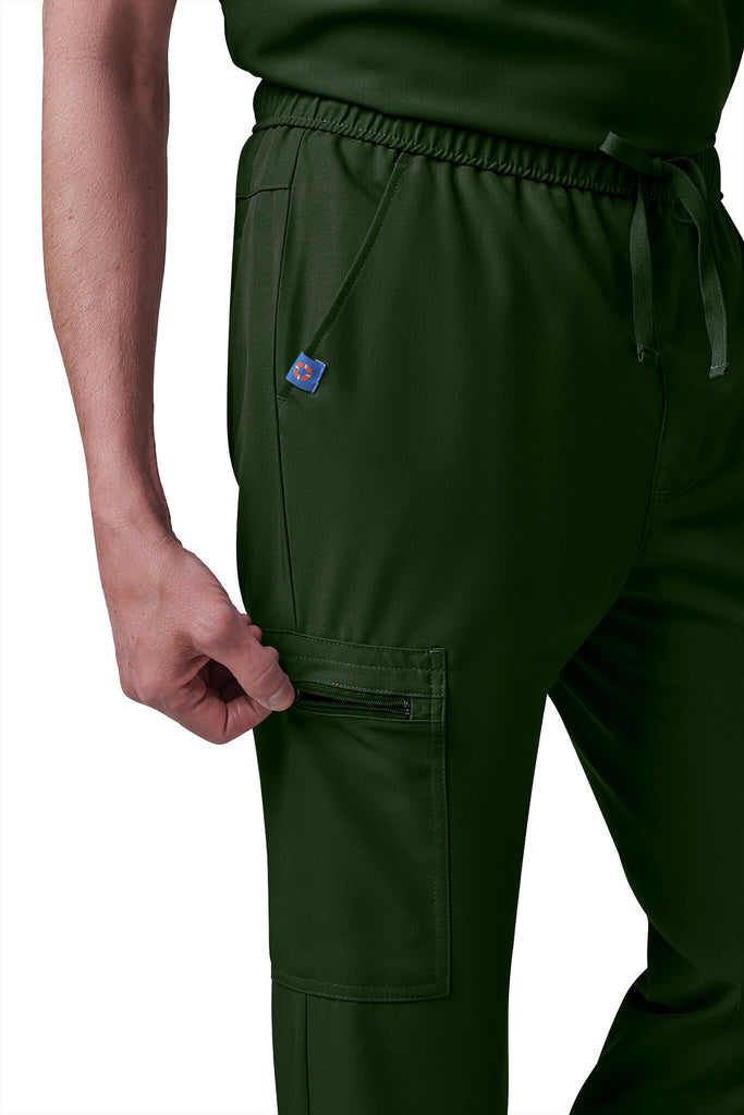 Man wearing MedTailor men's custom scrub pants in Highland Green color fabric