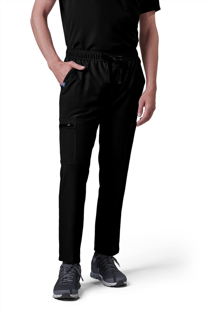 Man wearing MedTailor men's custom scrub pants in Jet Black color fabric