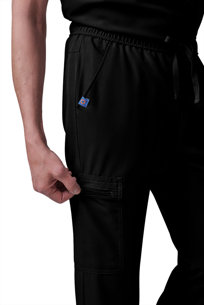 Man wearing MedTailor men's custom scrub pants in Jet Black color fabric