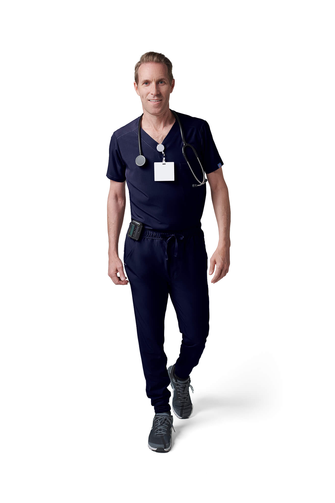 Man wearing MedTailor men's custom scrub pants in Navy Blue color fabric