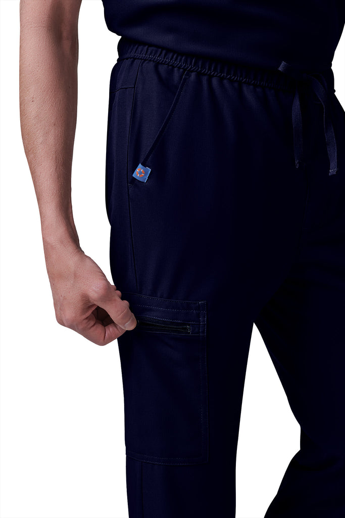 Man wearing MedTailor men's custom scrub pants in Navy Blue color fabric