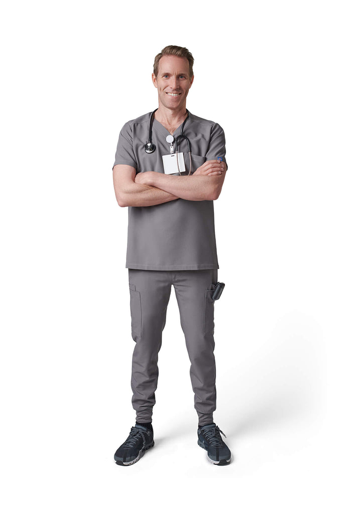 Man wearing MedTailor men's scrub pants in Platinum Gray color fabric