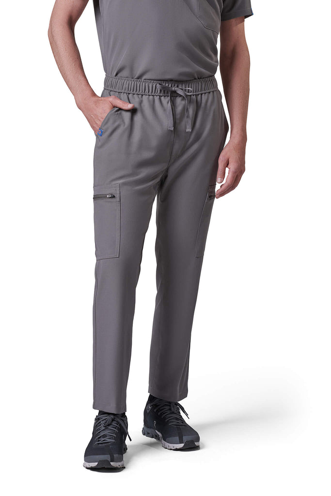 Man wearing MedTailor men's scrub pants in Platinum Gray color fabric