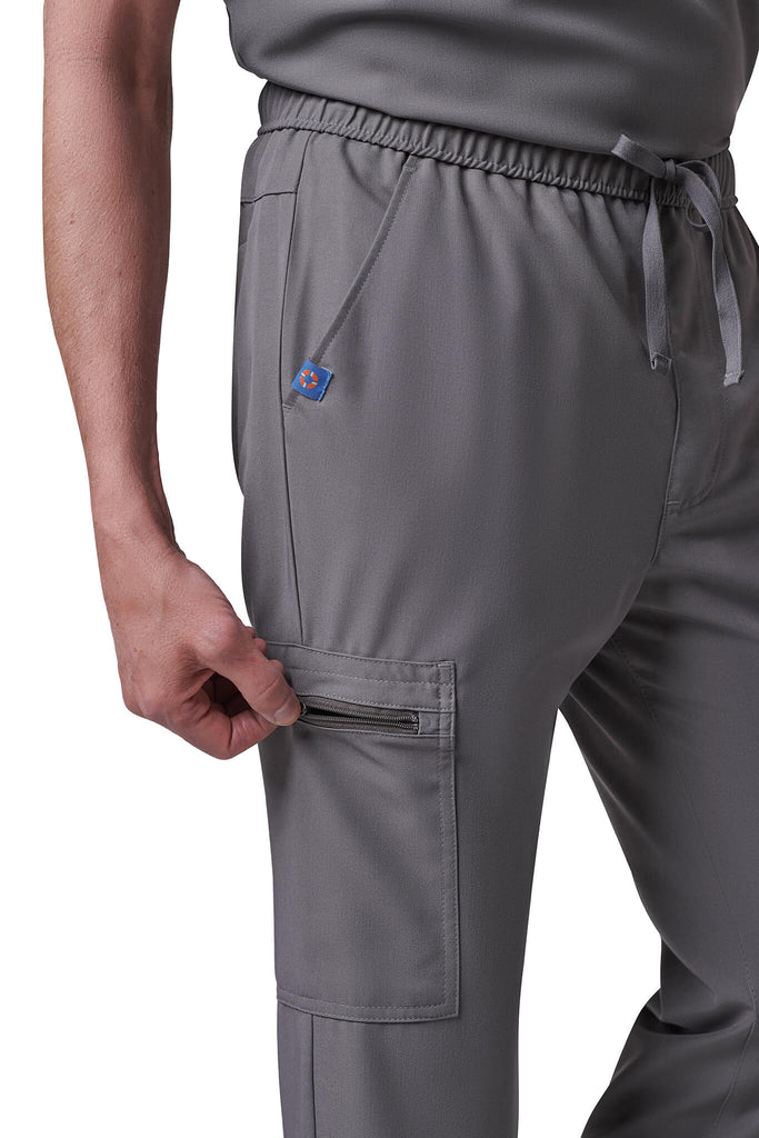 Man wearing MedTailor men's custom scrub pants in Platinum Gray color fabric
