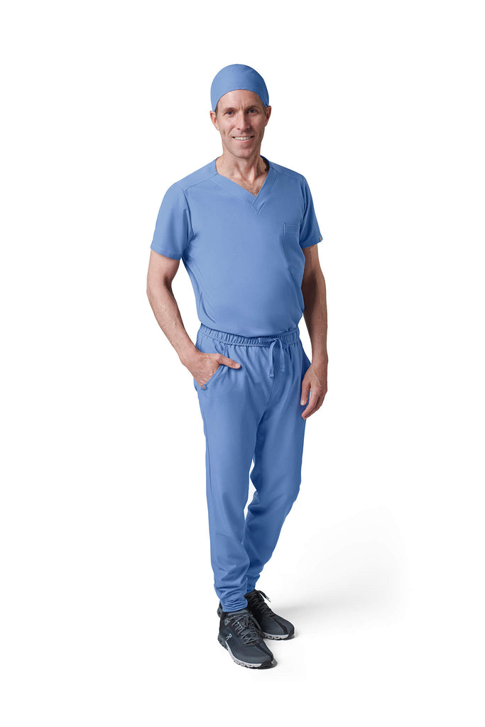 Man wearing MedTailor men's custom scrub cap in Sky Blue color fabric