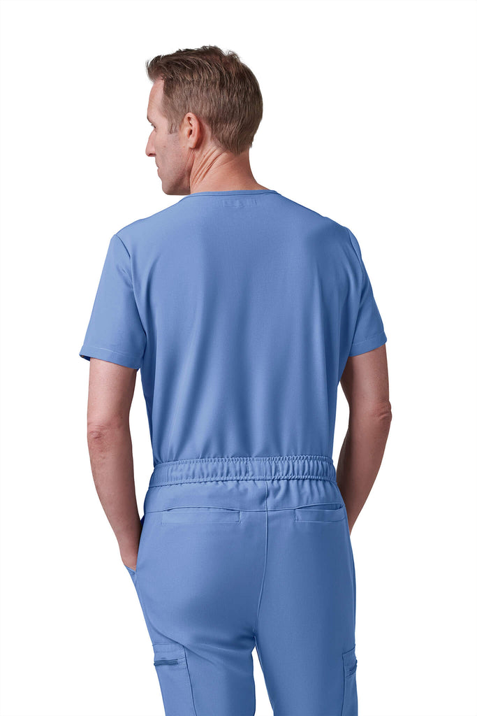 Man wearing MedTailor men's custom scrub pants in Sky Blue color fabric