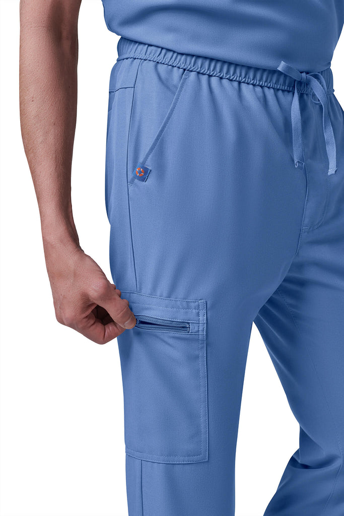 Man wearing MedTailor men's custom scrub pants in Sky Blue color fabric
