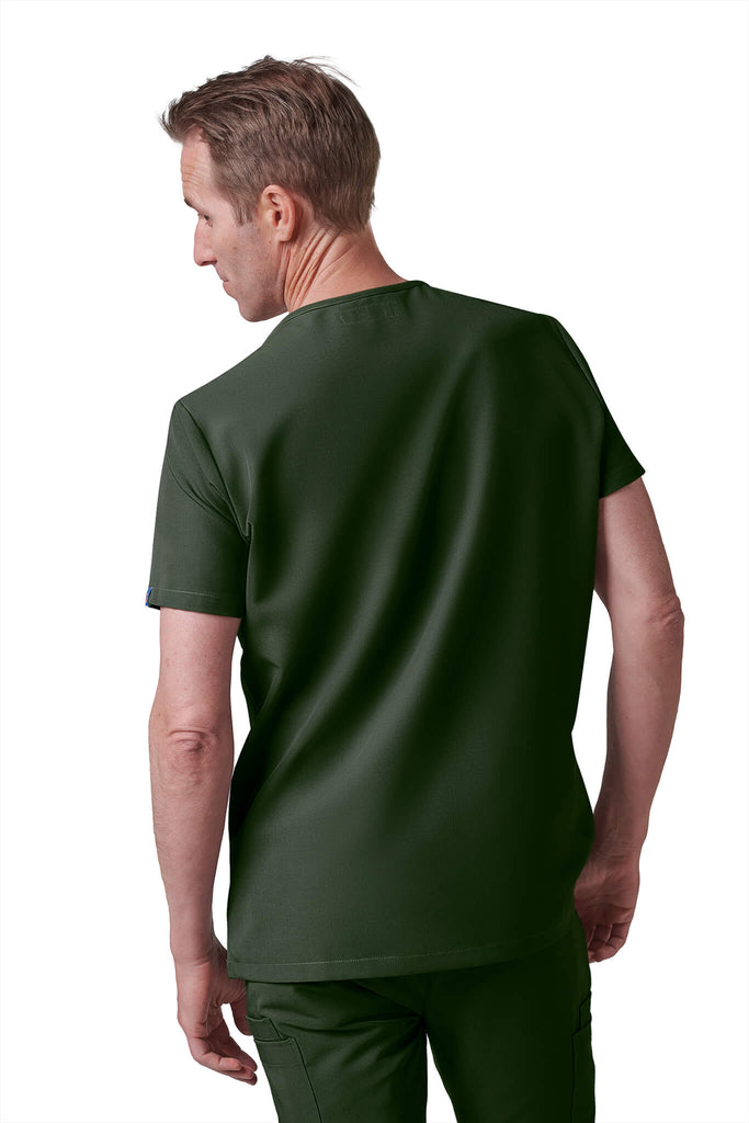 Man wearing MedTailor men's custom scrub top in Highland Green color fabric