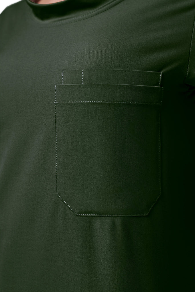 Man wearing MedTailor men's custom scrub top in Highland Green color fabric