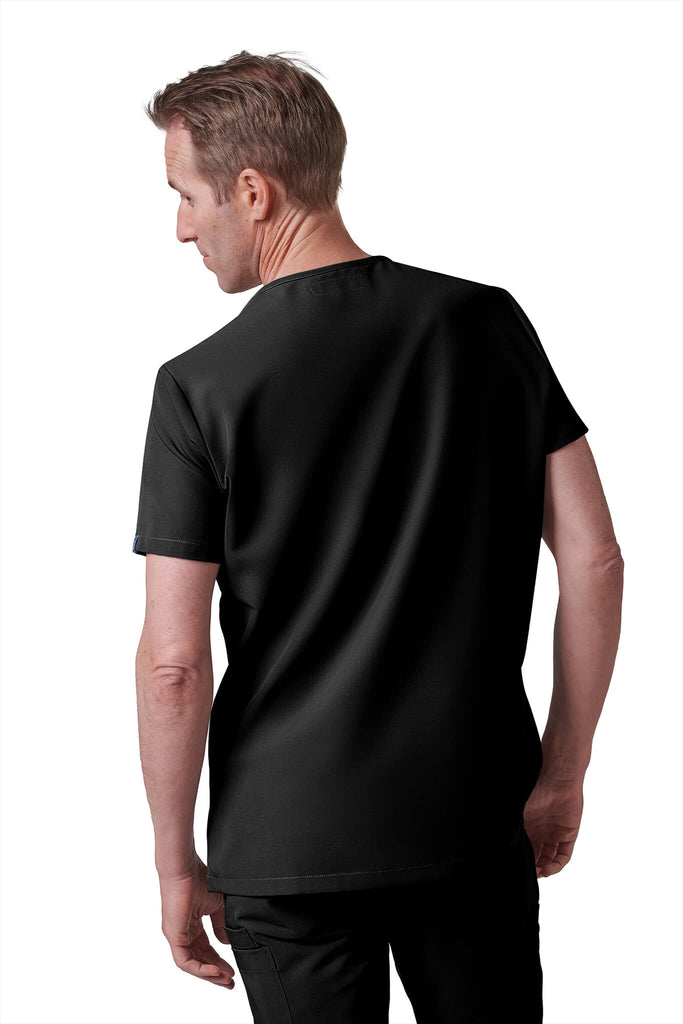 Man wearing MedTailor men's custom custom scrub top in Jet Black color fabric