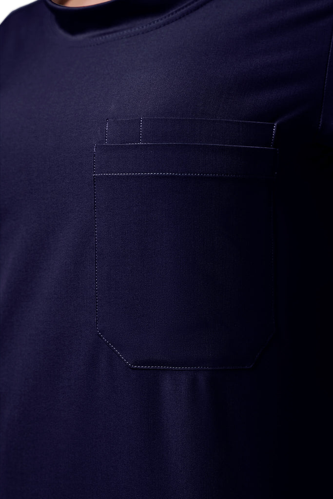 Man wearing MedTailor men's scrub top in Navy Blue color fabric