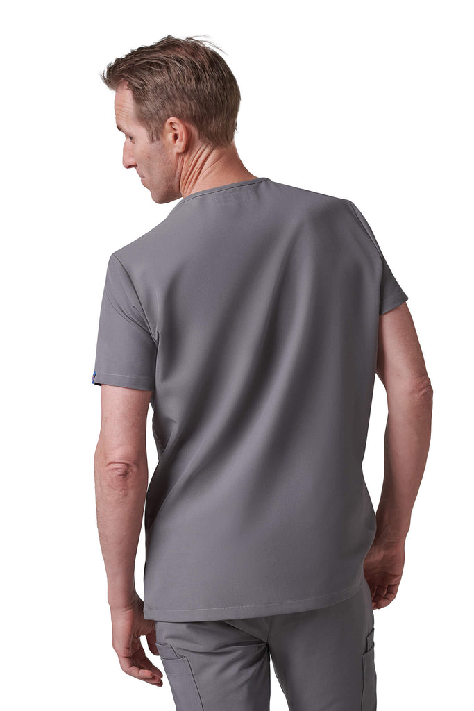Man wearing MedTailor men's custom scrub top in Platinum Gray color fabric