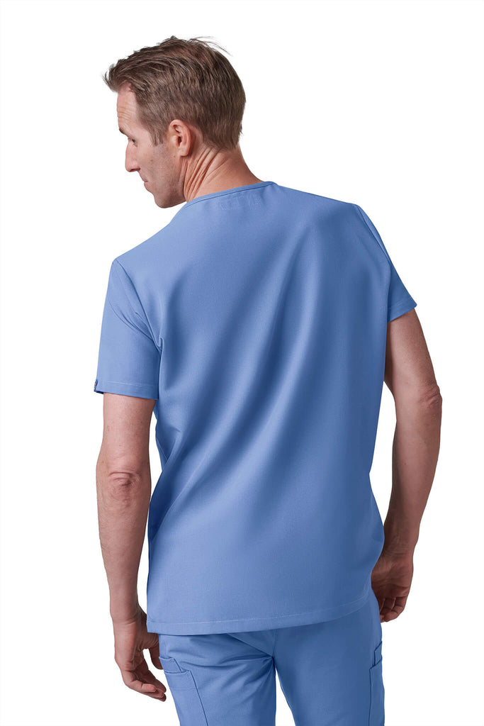 Man wearing MedTailor men's custom scrub top in Sky Blue color fabric