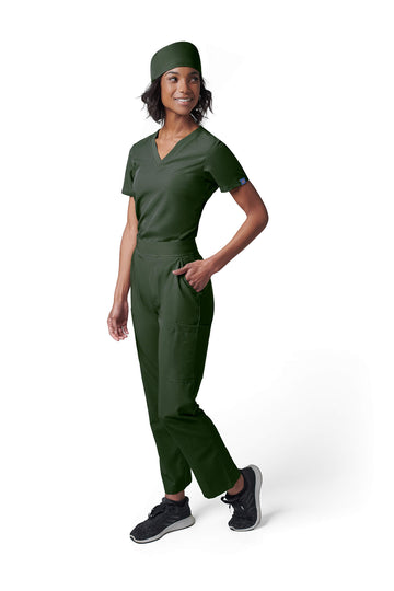 Woman wearing MedTailor women's scrub cap in Highland Green color fabric