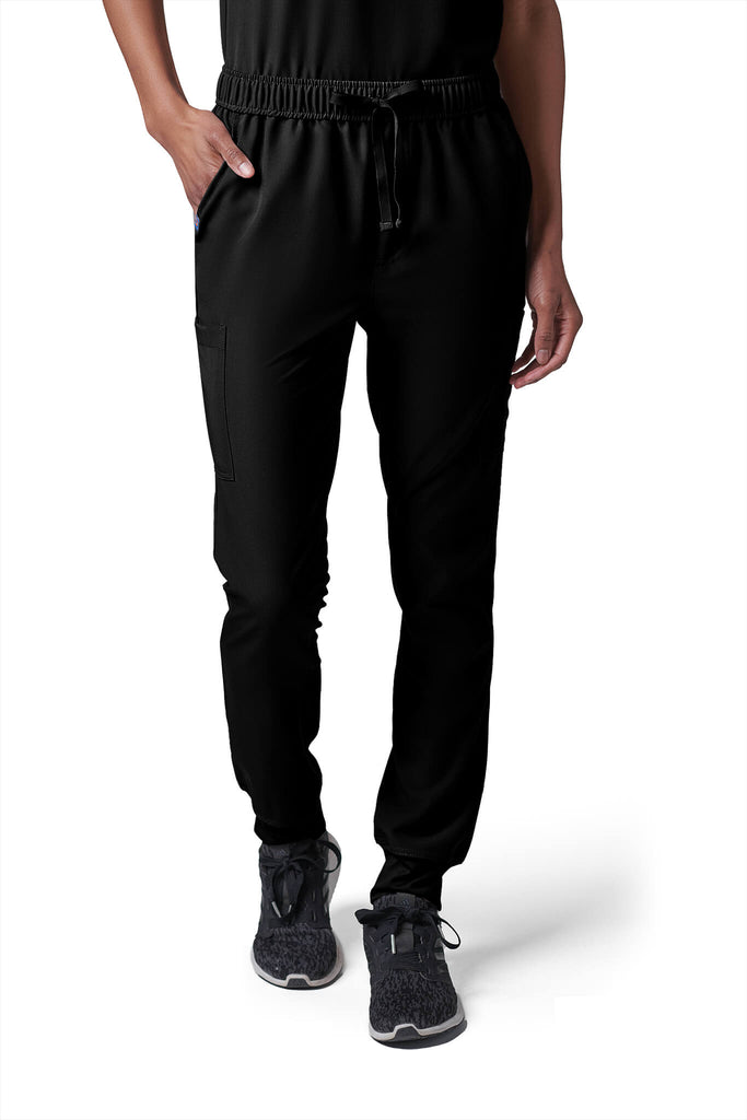 Woman wearing MedTailor women's scrub pants in Jet Black color fabric