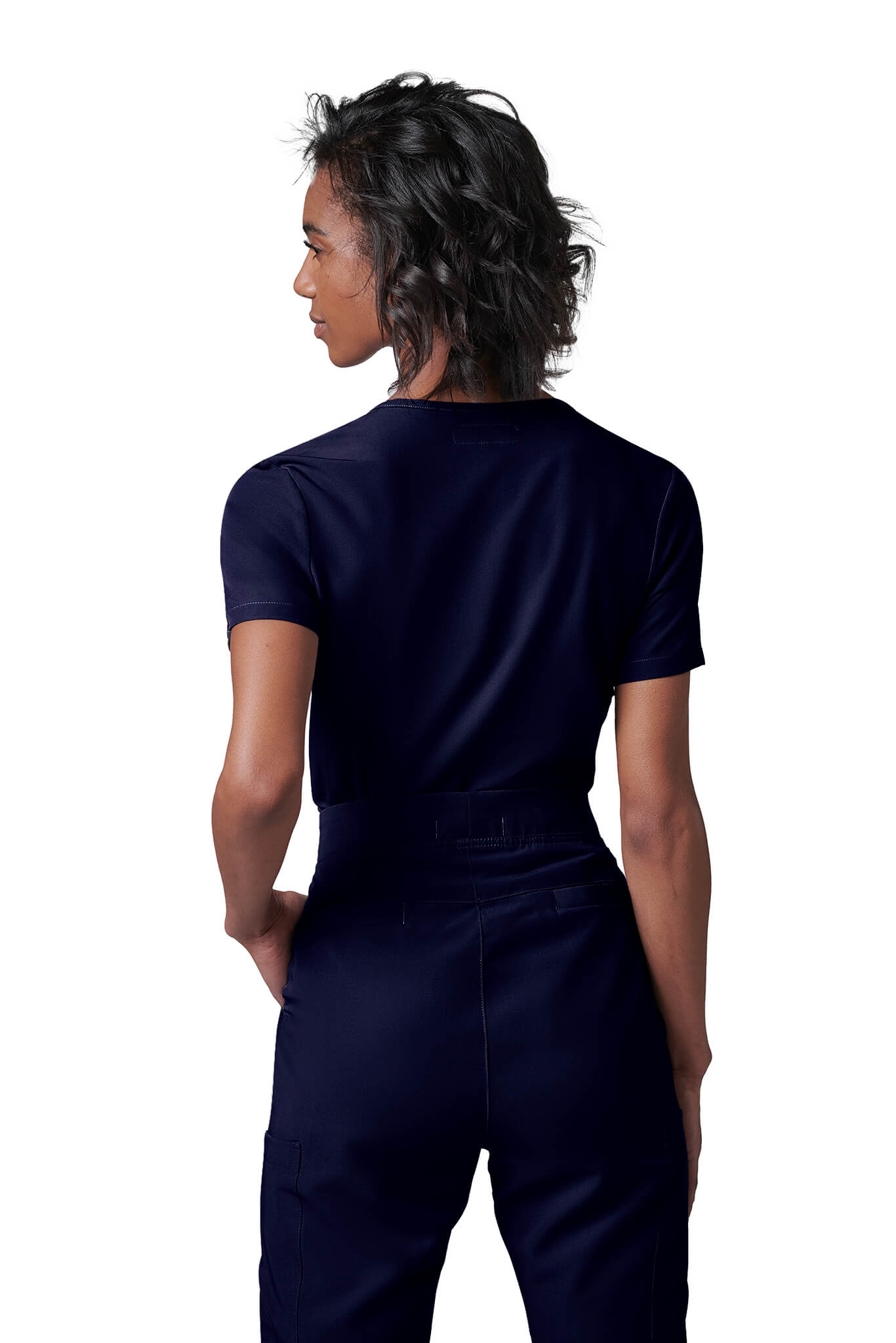 Woman wearing MedTailor women's custom scrub pants in Navy Blue color fabric