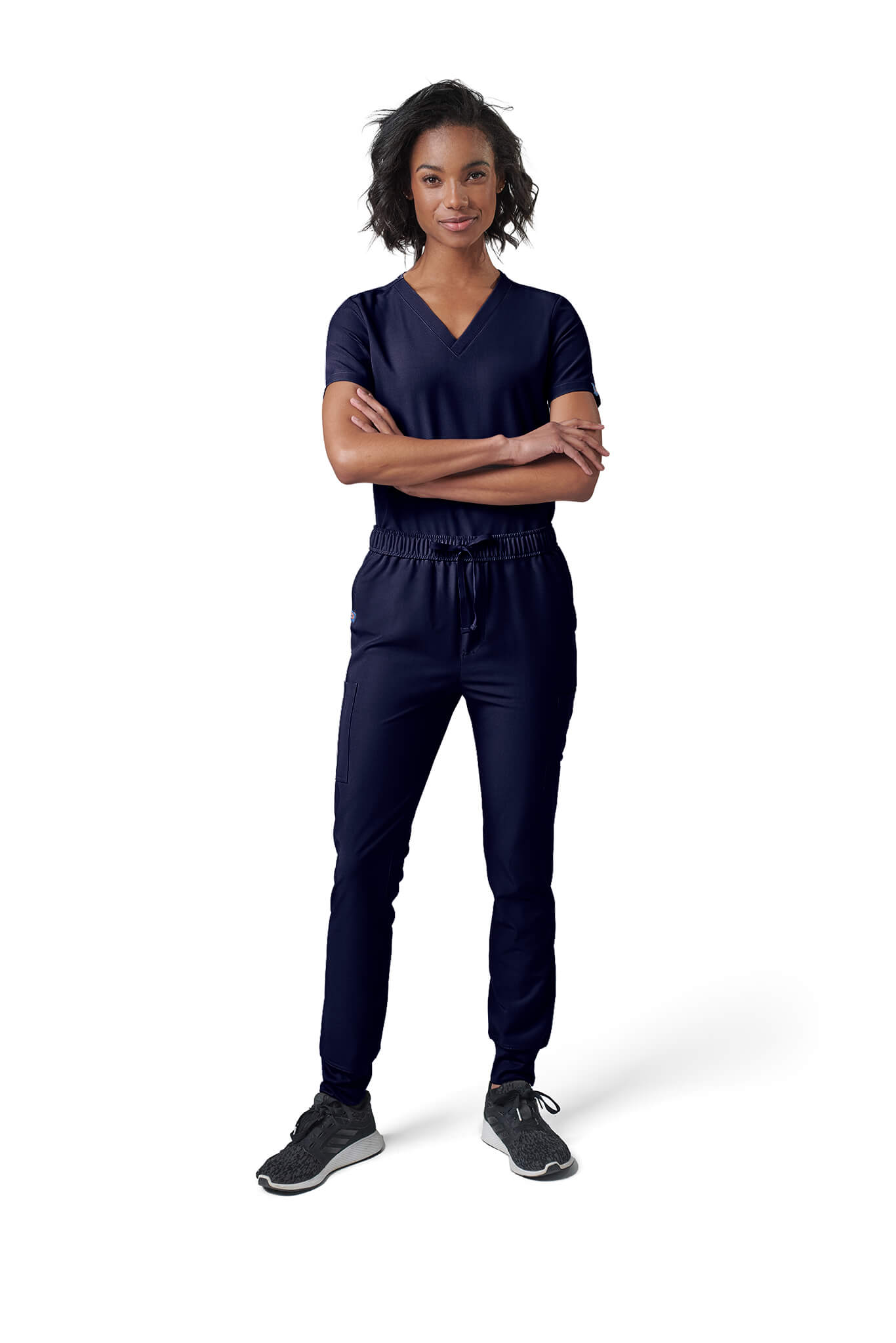 Woman wearing MedTailor women's custom scrub pants in Navy Blue color fabric