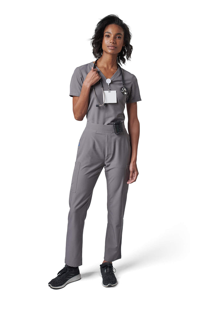 Woman wearing MedTailor women's scrub pants in Platinum Gray color fabric