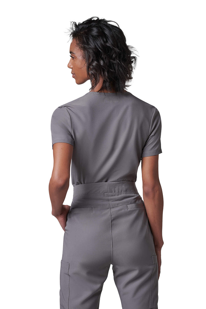 Woman wearing MedTailor women's scrub pants in Platinum Gray color fabric
