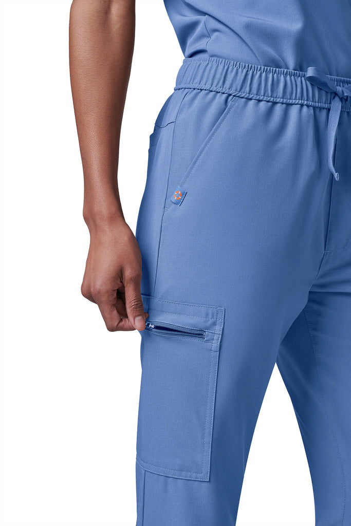 Woman wearing MedTailor women's scrub pants in Sky Blue color fabric
