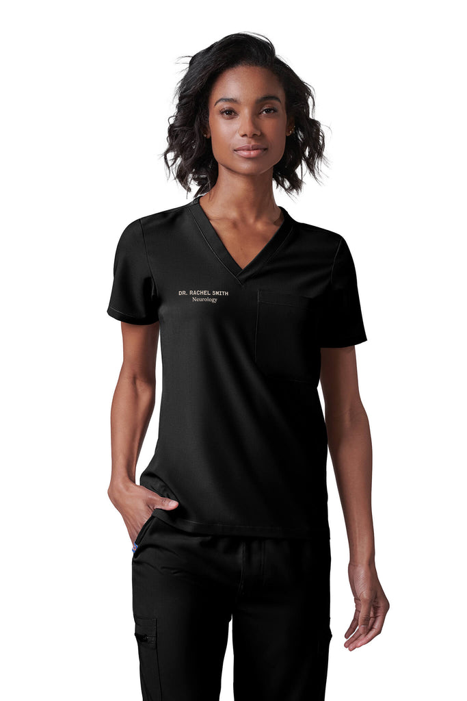 Woman wearing MedTailor women's scrub top in Jet Black color fabric