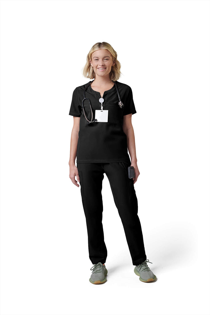 Woman wearing MedTailor women's scrub top in Jet Black color fabric