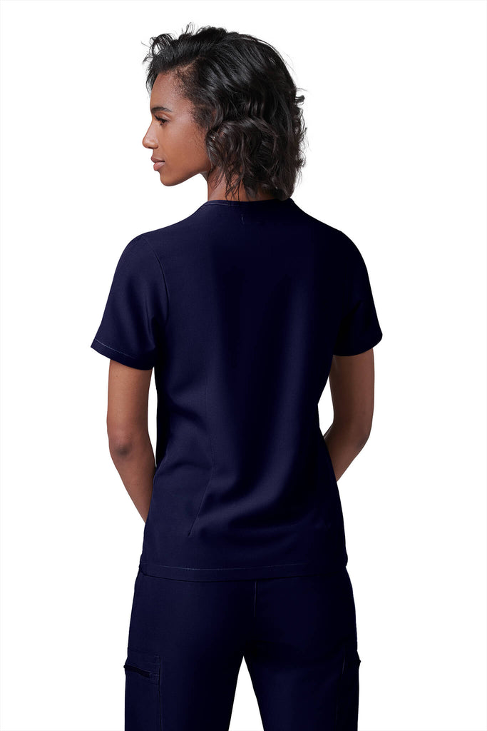 Woman wearing MedTailor women's scrub top in Navy Blue color fabric
