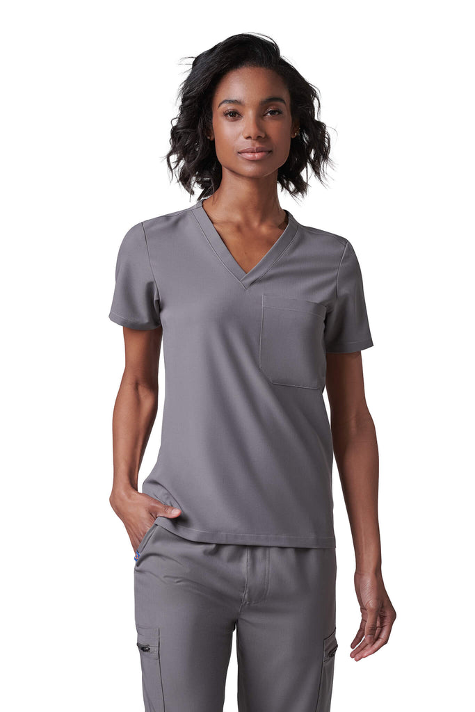 Woman wearing MedTailor women's scrub top in Platinum Gray color fabric